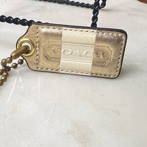 Coach Cream and Gold Bag Charm